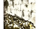 Here we see the Wailing Place by the Western Wall where prayers are offered up fervently throughout the Day of Atonement. An early photograph.